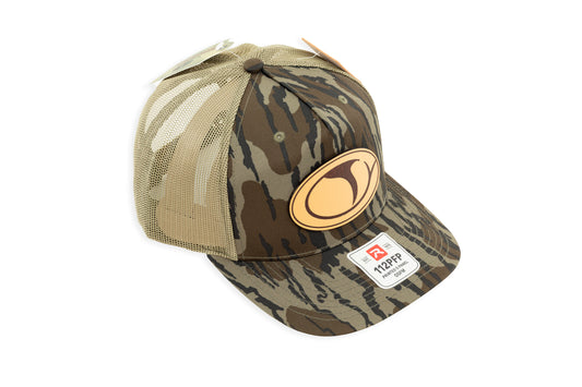 COLE APPAREL | 112 LEATHER PATCH HAT | MOSSY OAK BOTTOMLAND LODEN